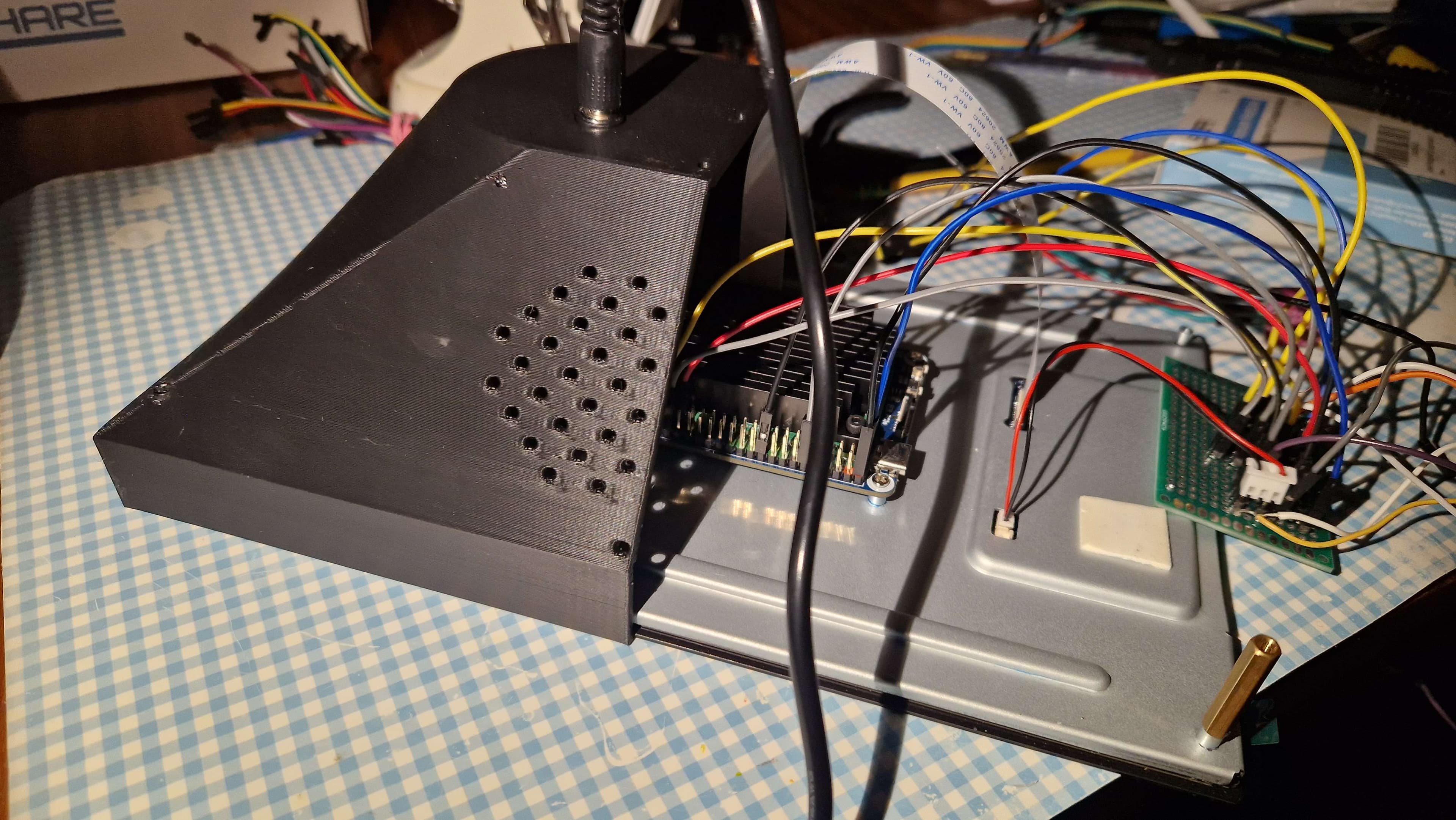 Ella's actual 3D-printed enclosure, Raspberry Pi and connected electronics during assembly